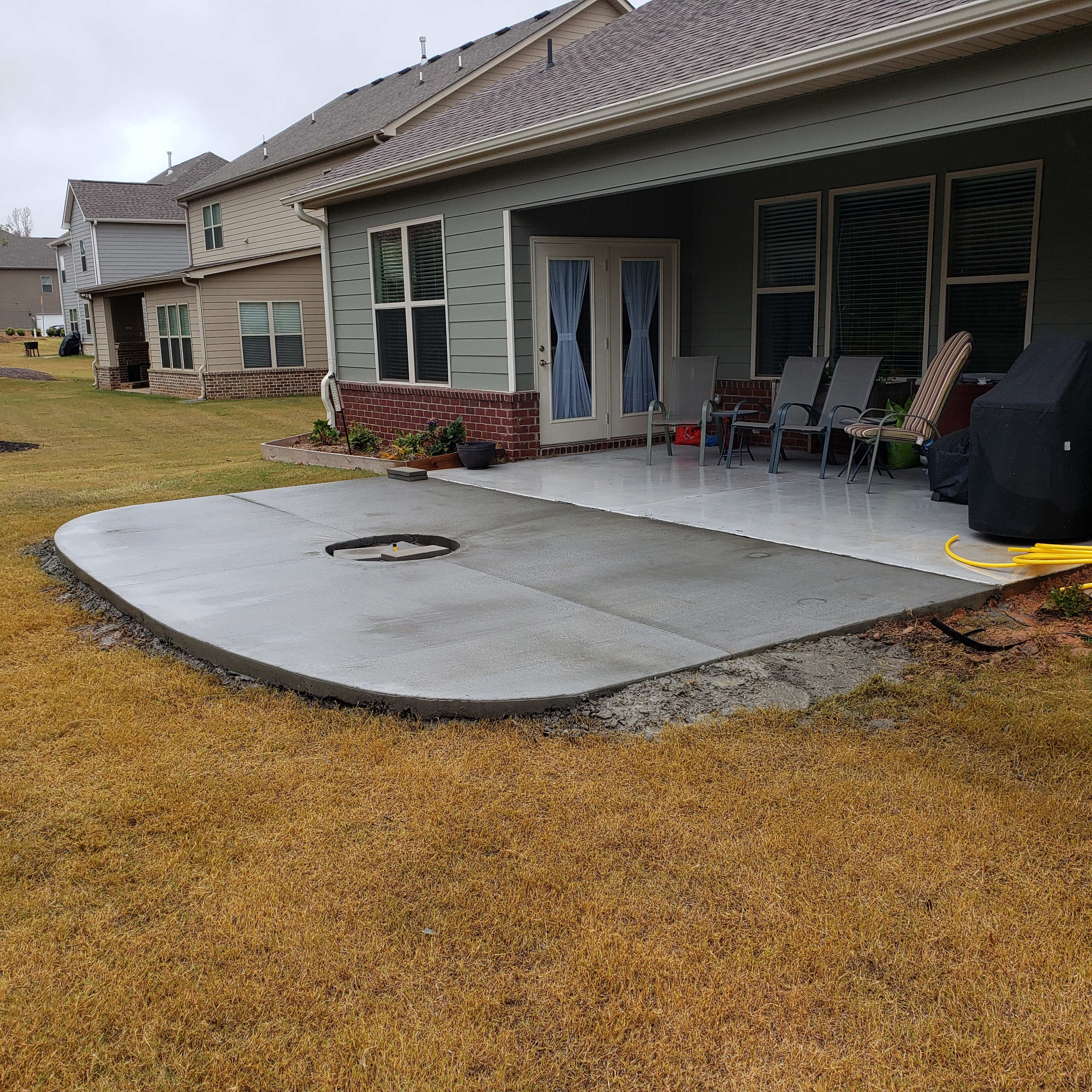 concrete patio with firepit